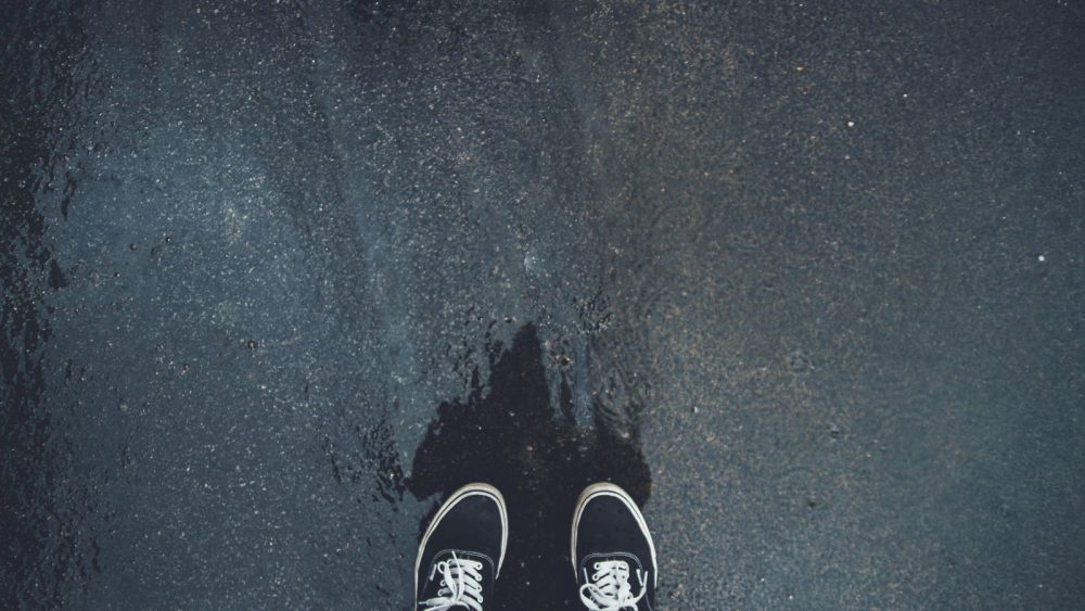 Birds eye view of two feet standing on the ground