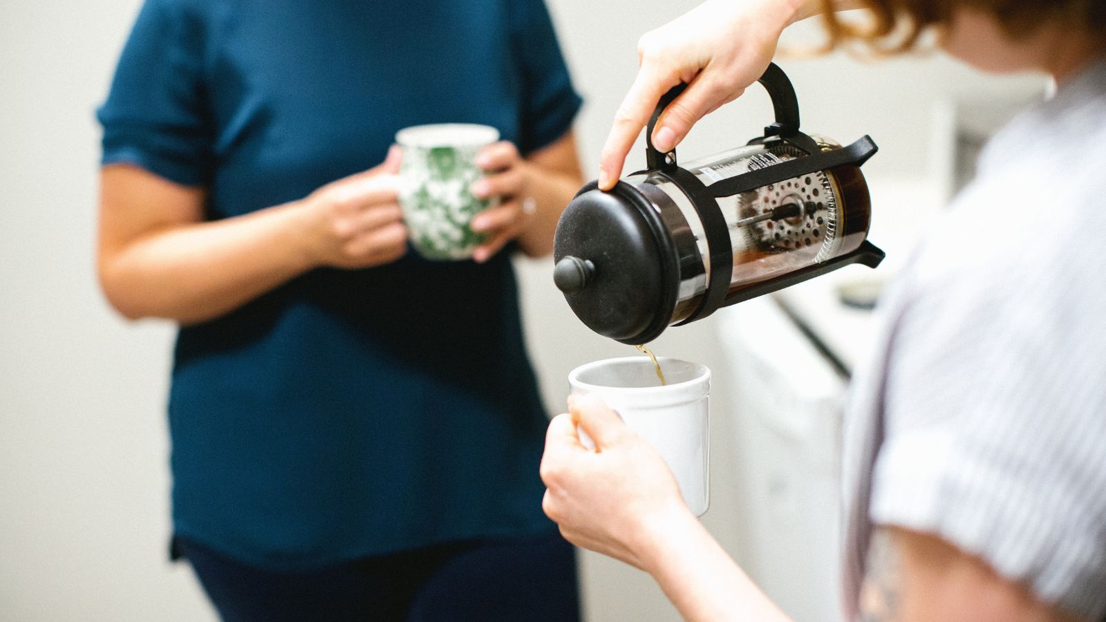 Pouring coffee from a caffetiere