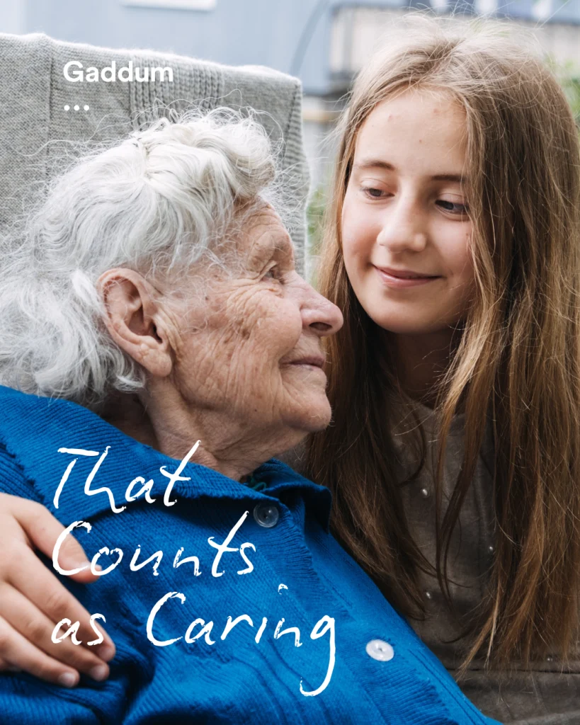 Young granddaughter with her arm around her grandmother